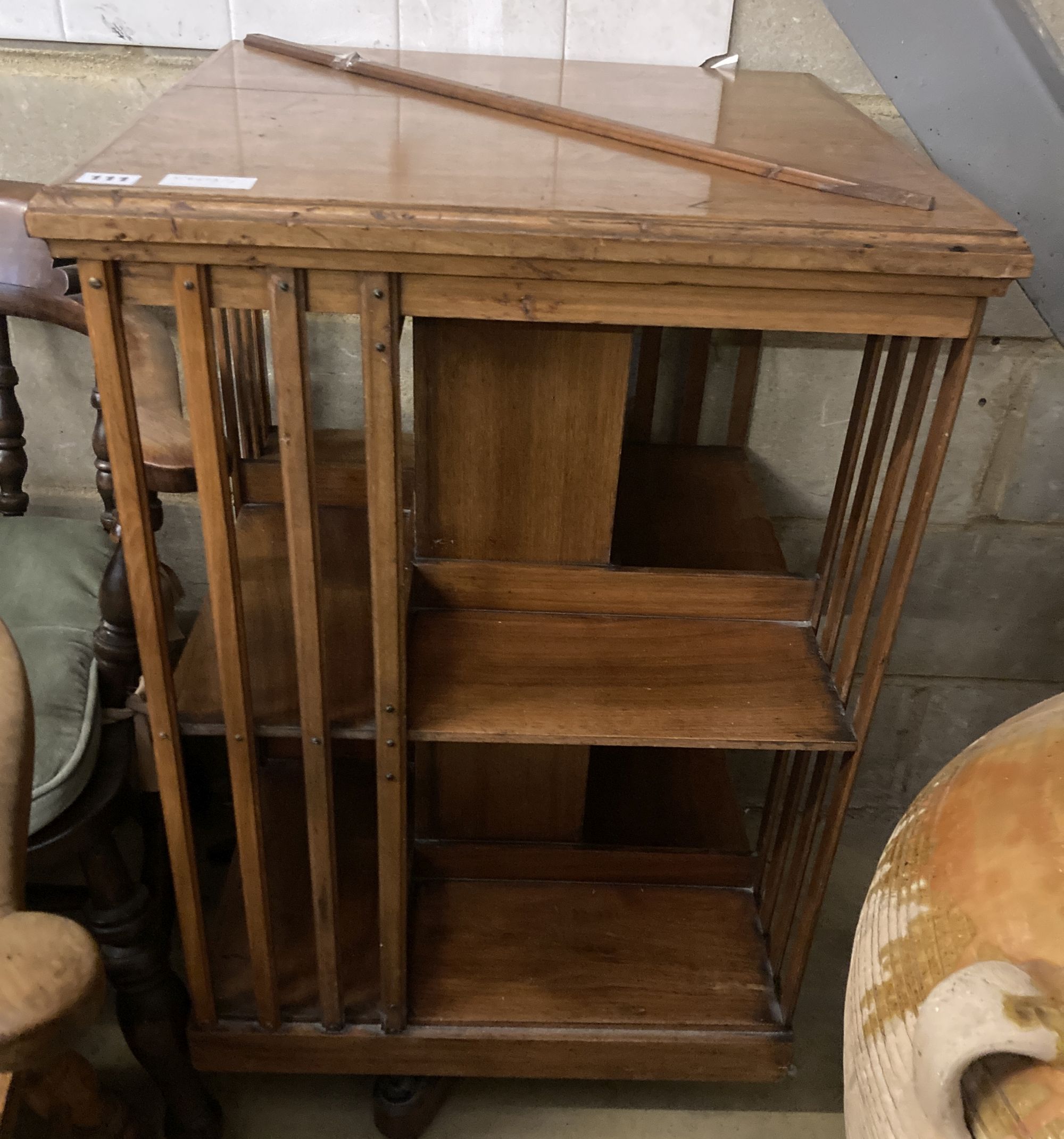 An Edwardian walnut revolving bookcase, width 56cm, height 96cm